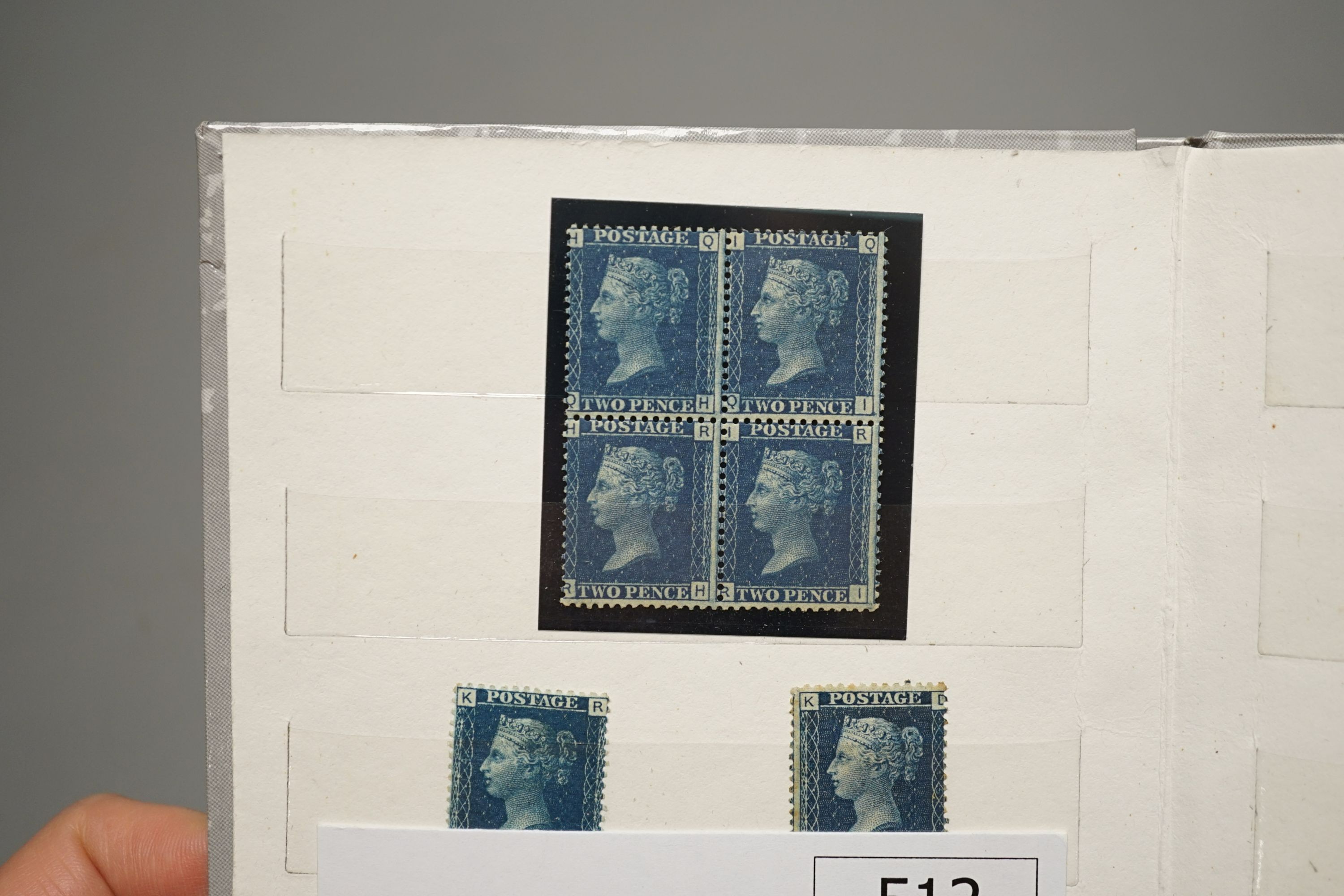 Great Britain - small stock book 2d blues with 1841 2d used strip of three, 6 singles used. 1858 2d plate 13 and plate 14 mint blocks of four